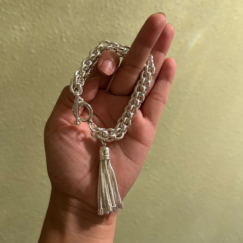 Thick silver bracelet with tassel